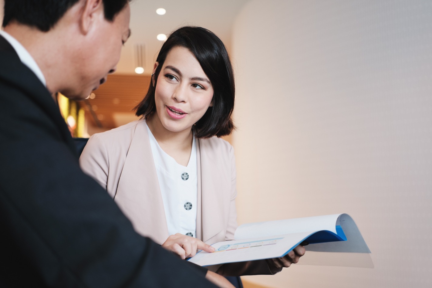 gallery/investment-plan-agent-showing-documents-to-asian-efp7dym